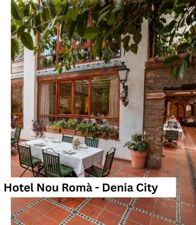 Historischer Innenhof mit Steinmauern und Pflanzen im Hotel Nou Romà Denia